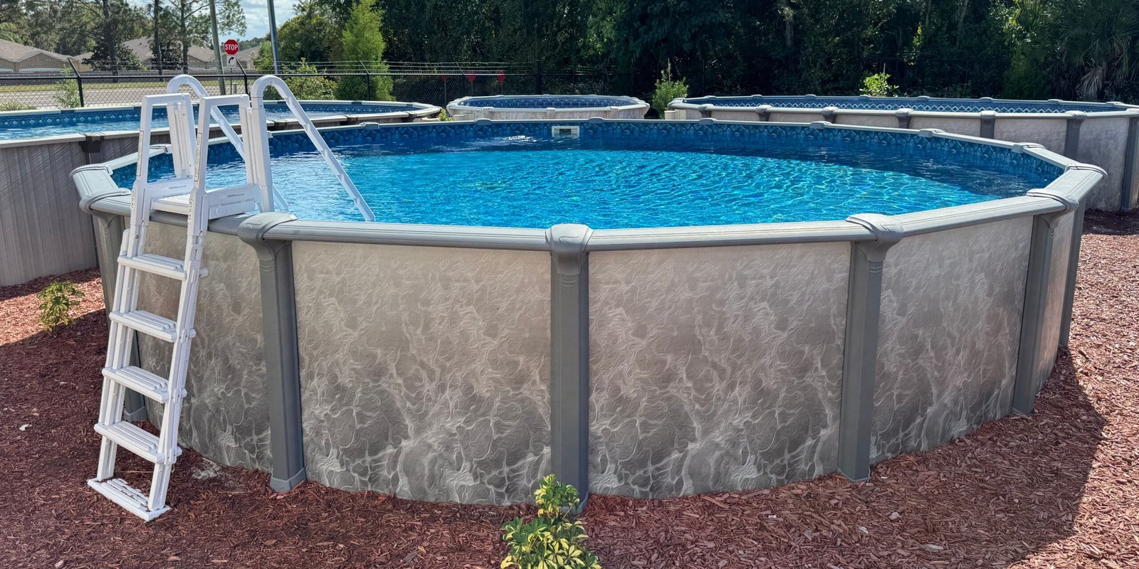 Above ground swimming pool with ladder