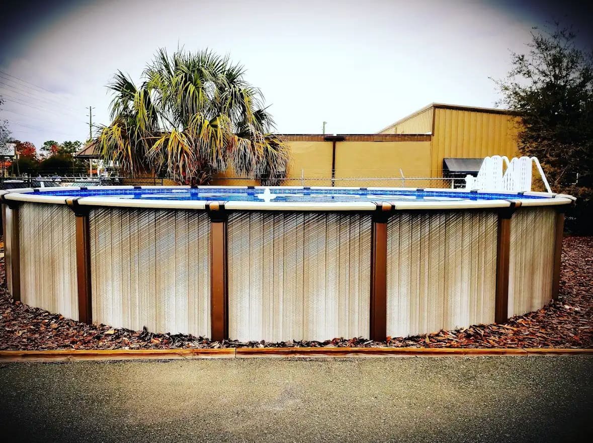 Above Ground Swimming Pools 10 An above ground pool in a customer's backyard at Mr. Pool Crystal River location