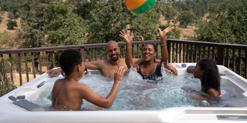 Portable Spas & Hot Tubs At Mr. Pool of Pasco & Crystal River 11 hot spring spas hot spot collection page cspot lifestyle family in spa playing 1 scaled 1