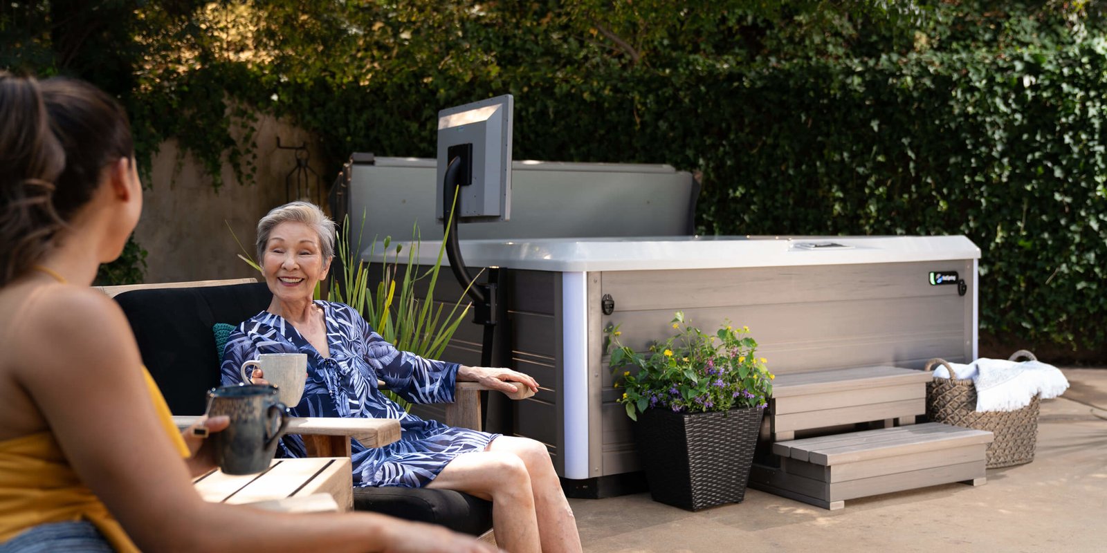 Portable Spas & Hot Tubs At Mr. Pool of Pasco & Crystal River 12 two ladies sitting next to Hot Spring Limelight Spa